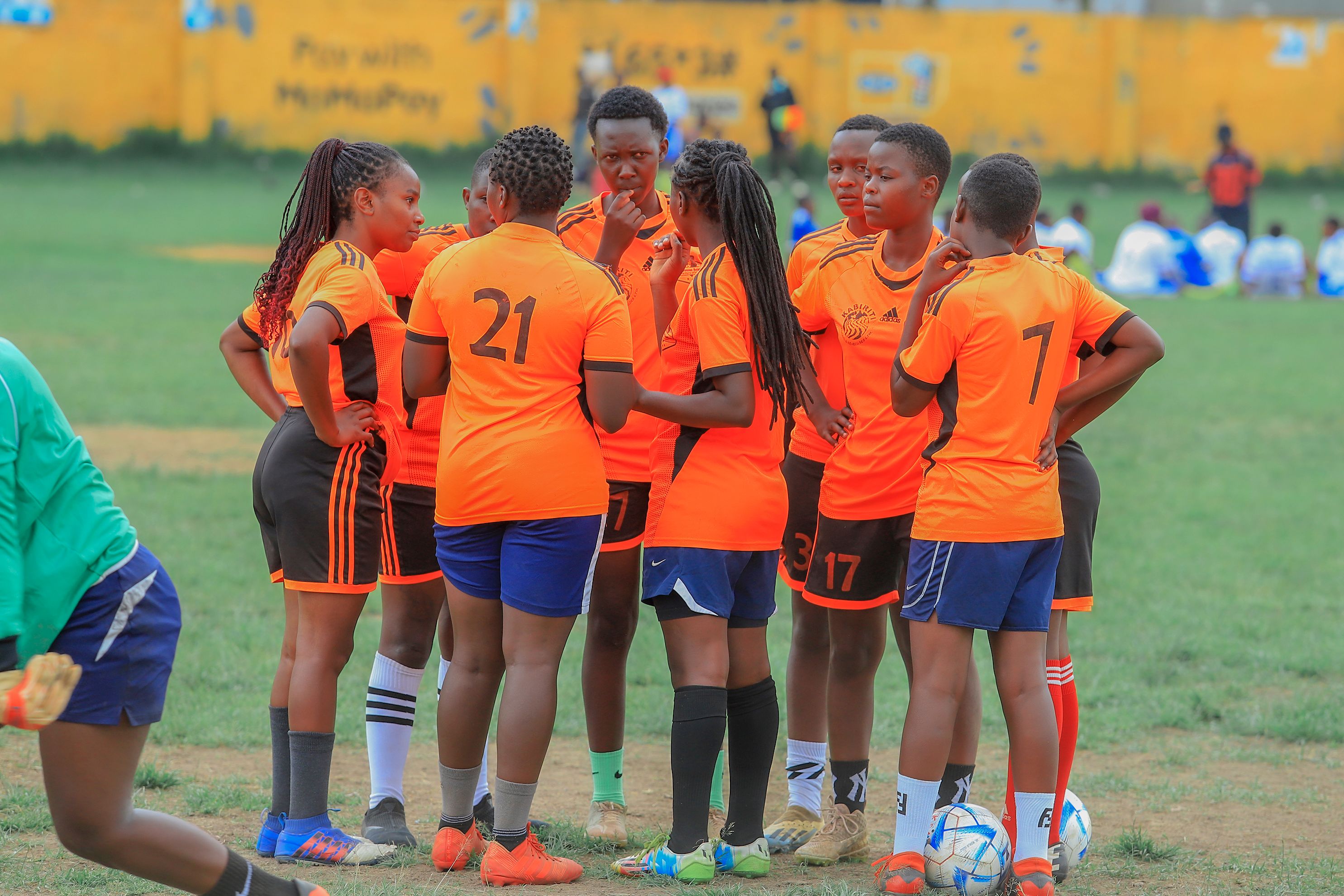 a team huddled together on the pitch