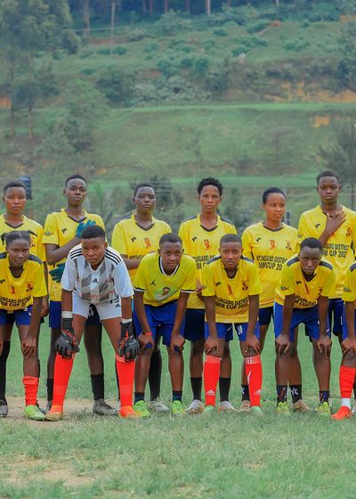 a team lined up for a photo with their coaches