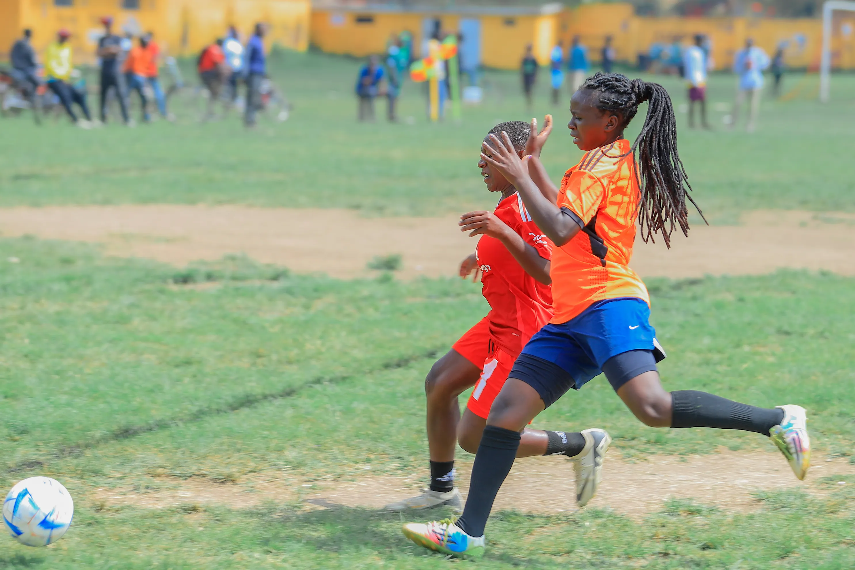 two players contesting the ball during a match