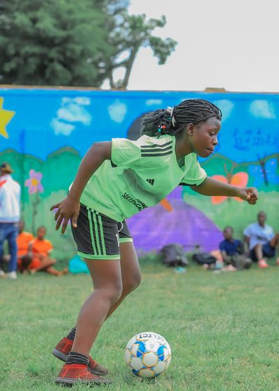 a player dribbling the ball on the pitch
